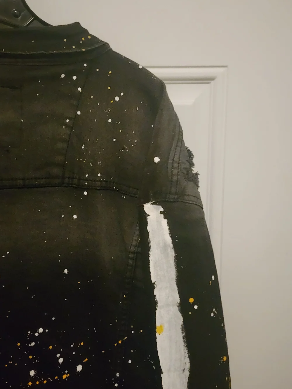 Men's Black Distressed Paint-Splatter Denim Jacket with Yellow Accents